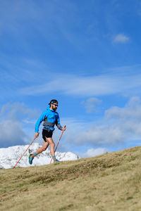 Full length of senior man on land against sky