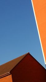 Low angle view of building against clear blue sky