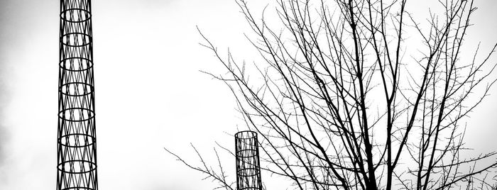 Low angle view of silhouette bare tree against sky