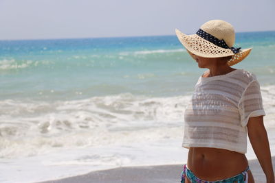 Rear view of senior woman on beach