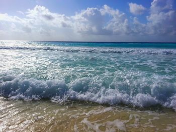 Scenic view of sea against cloudy sky