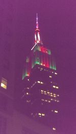 Low angle view of illuminated building at night