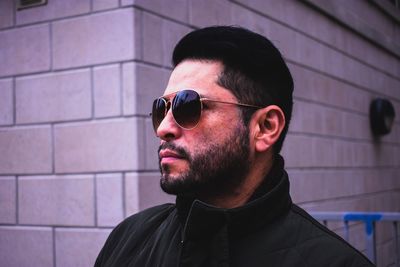 Portrait of young man wearing sunglasses