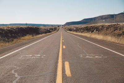 Road amidst landscape against clear sky