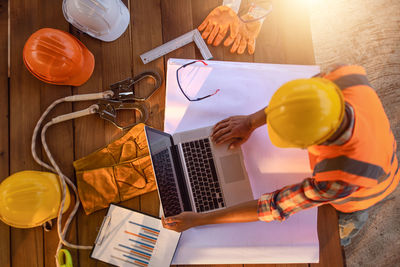 High angle view of man working on table