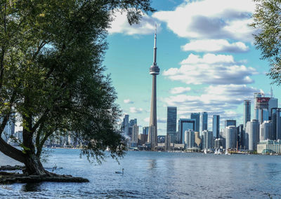 City at waterfront against sky