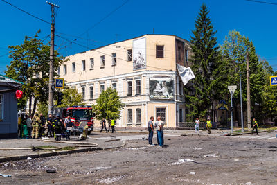 Street amidst buildings against clear sky