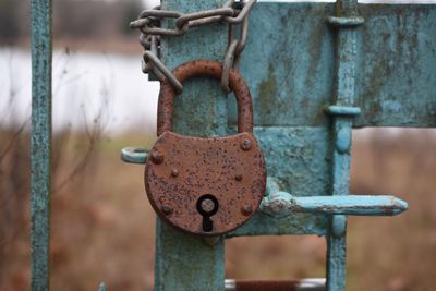 Close-up of padlock on railing