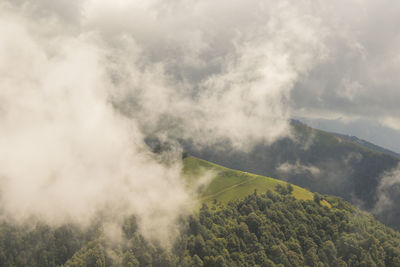 Tusheti mountain landscape and view, high angle, georgian nature, clouds and forest