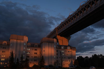 Low angle view of buildings against sky during sunset