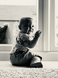 Girl looking away while sitting at home