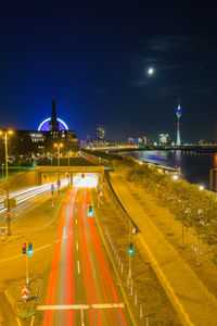 High angle view of light trails on road at night