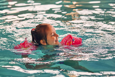 Woman swimming in pool