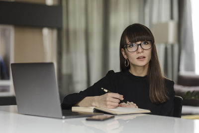 Portrait of woman using smart phone