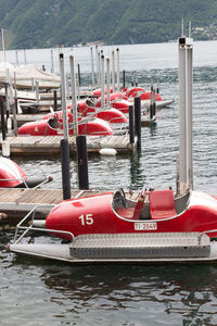 Red boats moored at harbor