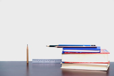 Stack of books against white background