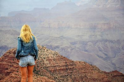 Rear view of woman looking at mountains