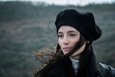 Portrait of young woman looking away