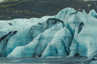 Glacier on frozen ocean coast landscape photo