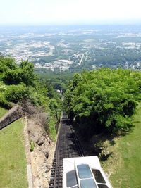 High angle view of plants and city against sky