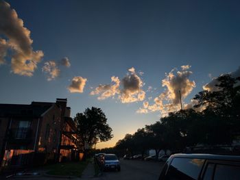 Cars on road against sky