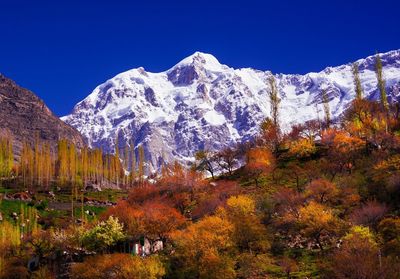 Scenic view of snowcapped mountains against clear sky