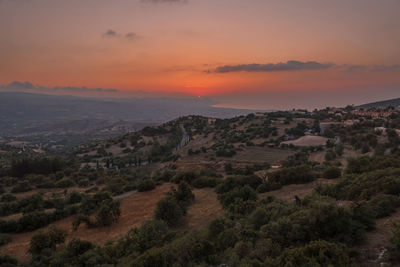 Scenic view of landscape against sky during sunset