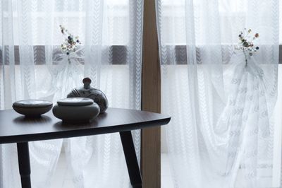 White flowers in vase on table