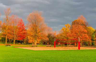 Trees on field against sky during autumn