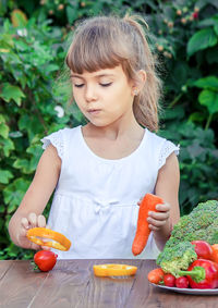 Portrait of cute girl eating food