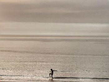 Man walking on beach