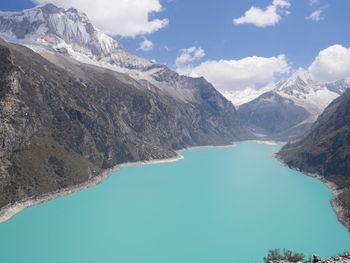 Scenic view of lake and mountains against sky