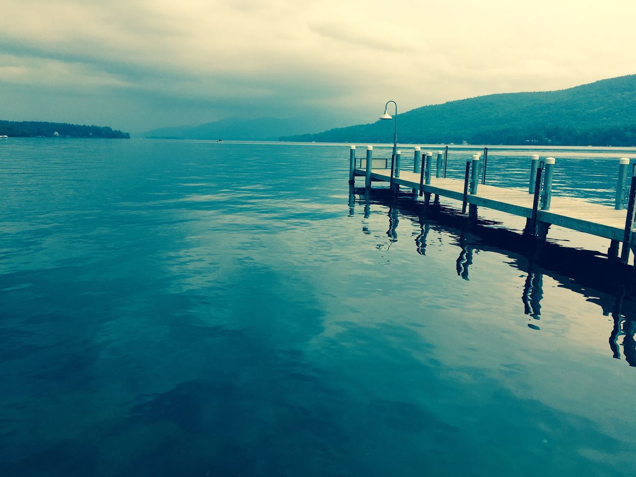 JETTY IN SEA AGAINST SKY