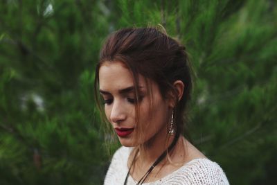 Portrait of a young woman looking away