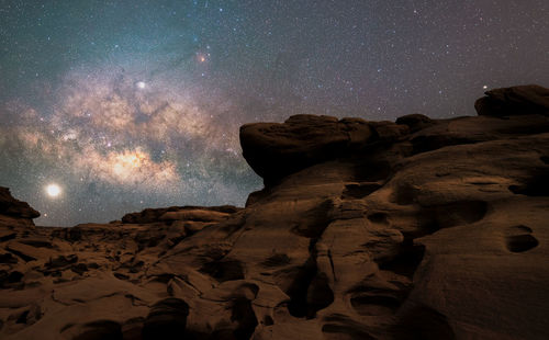 Low angle view of rock formation against sky