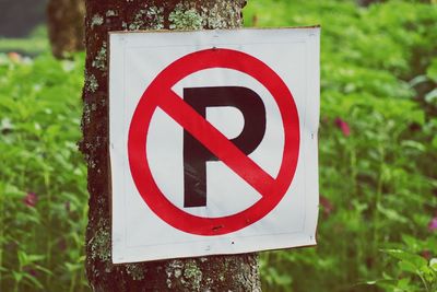 Close-up of arrow sign on road