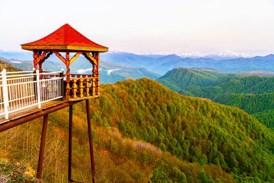 Built structure on landscape against sky