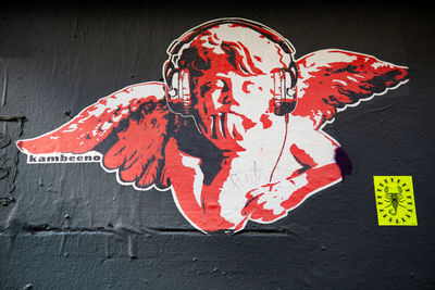 Close-up of red text on wall