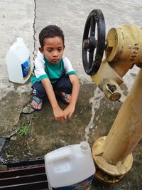 Boy standing at camera