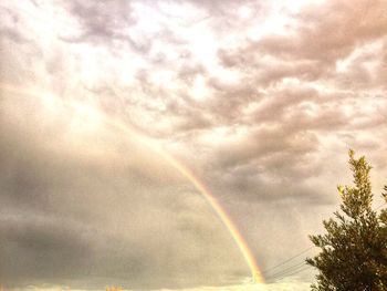 Low angle view of rainbow against sky