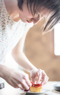 Woman preparing cake