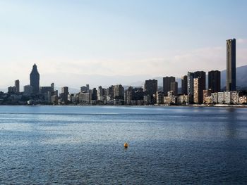 Sea with buildings in background