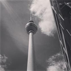 Low angle view of communications tower against sky