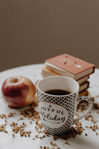 Close-up of cup on table