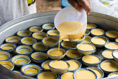 Cropped hand preparing food