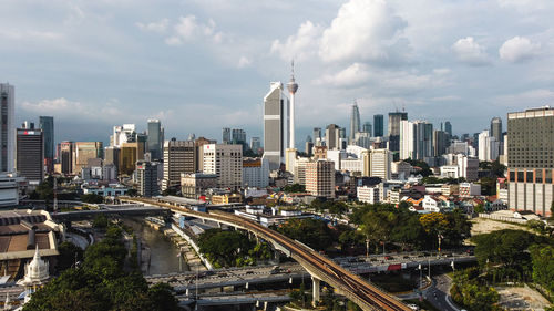 High angle view of street amidst buildings against sky
