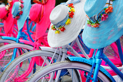 Close-up of colorful hats on bicycles