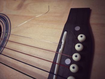 Close-up of guitar on table