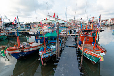 Boats moored at harbor