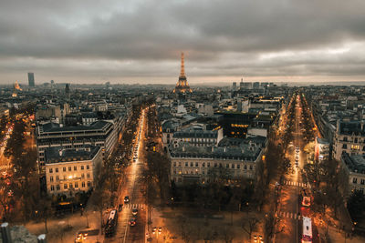 High angle view of city lit up at dusk